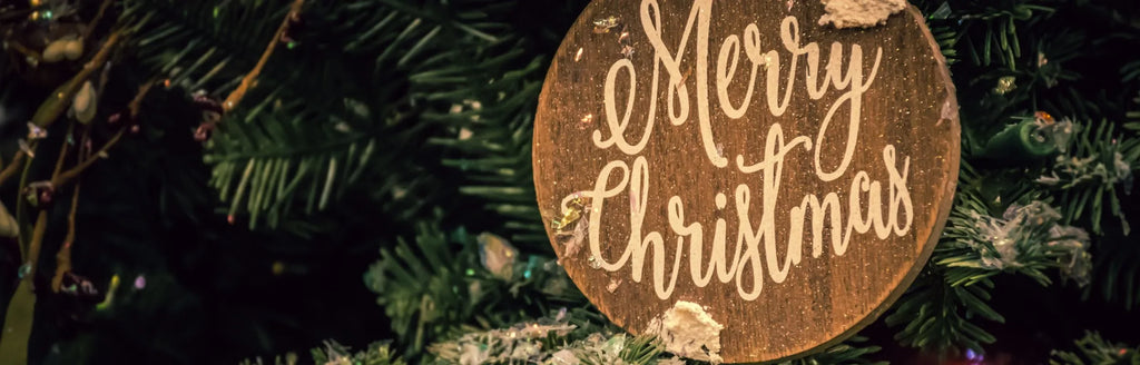 Merry Christmas Ornament on Christmas tree