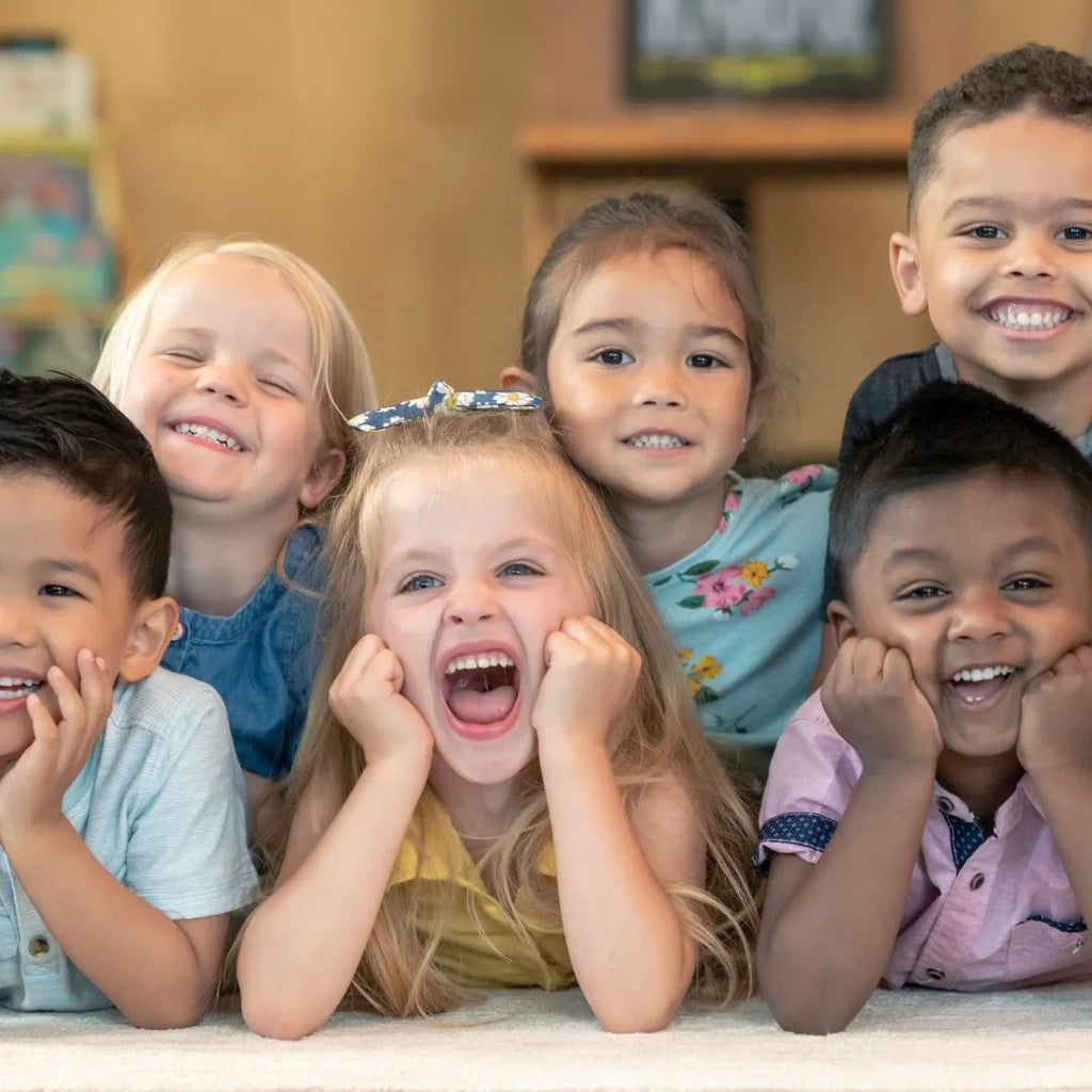 Six happy preschoolers smiling