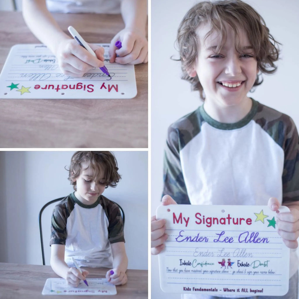Young boy actively practicing writing his name in cursive on the Cursive Handwriting Practice Board